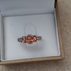 Peach sapphire and diamond ring
